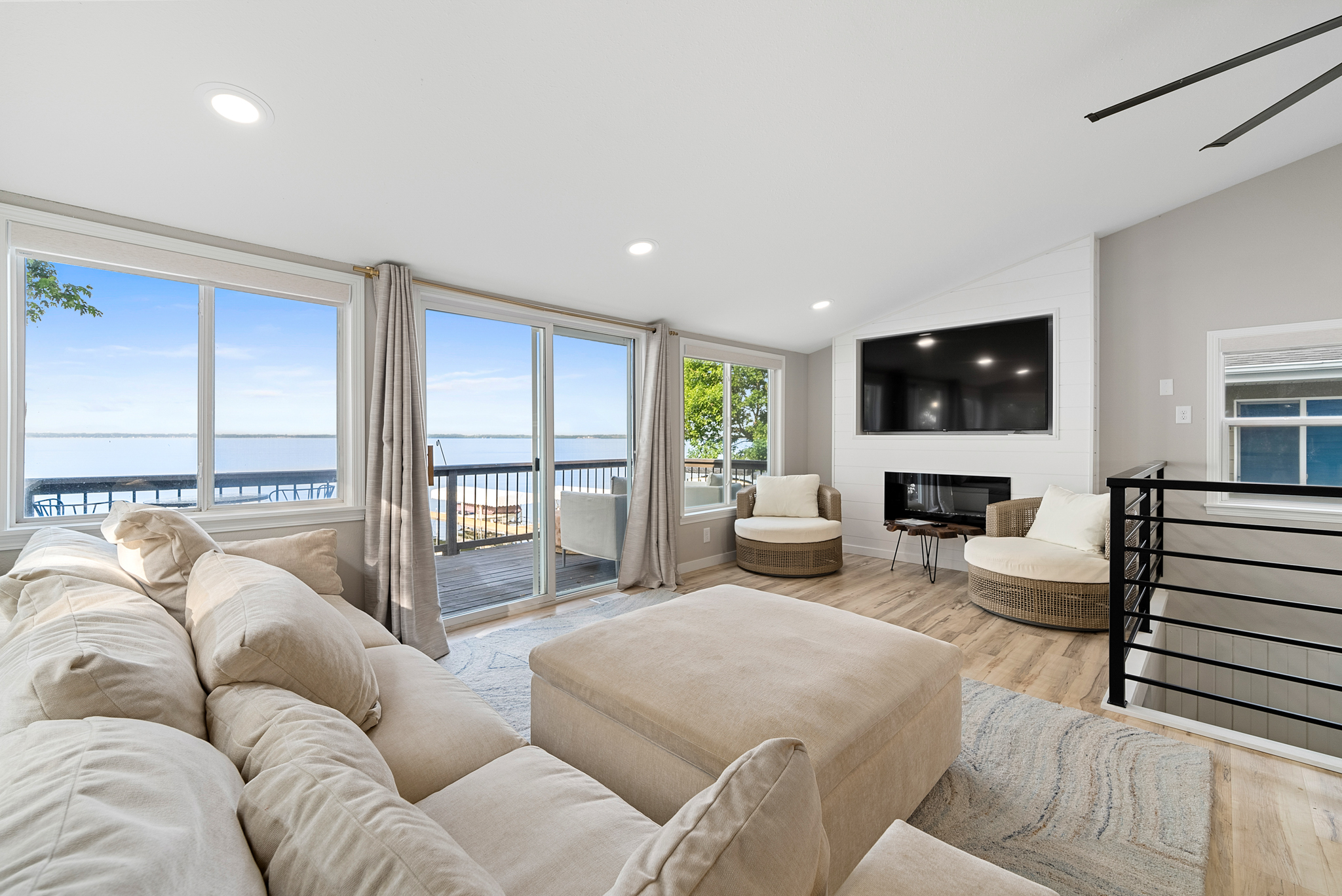 DSC06340 Two-story home with gray siding and fenced backyard at dusk in Sioux Falls, SD